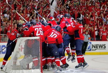 WASHINGTON - APRIL 28:  Simeon Varlamov #40 of the Washington Capitals is mobbed by his teammates after they defeated the New York Rangers during Game Seven of the Eastern Conference Quarterfinal Round of the 2009 Stanley Cup Playoffs on April 28, 2009 at the Verizon Center in Washington,  DC.  (Photo by Len Redkoles/Getty Images)