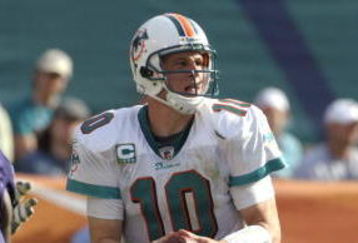 MIAMI, FL - JANUARY 4:  Quarterback Chad Pennington #10 of the Miami Dolphins sets to pass against the Baltimore Ravens in an NFL Wildcard Playoff Game at Dolphins Stadium on January 4, 2009 in Miami, Florida.  (Photo by Al Messerschmidt/Getty Images) 