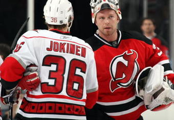 NEWARK, NJ - APRIL 28: Jussi Jokinen #36 of the Carolina Hurricanes shakes hands with Martin Brodeur #30 of the New Jersey Devils following Carolina's series win at Prudential Center on April 28, 2009 in Newark, New Jersey.  Carolina defeated New Jersey by a score of 4-3. (Photo by Bruce Bennett/Getty Images)
