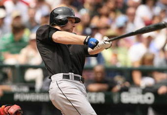 SEATTLE - JULY 1:  Adam Lind #26 of the Toronto Blue Jays hits the ball during the MLB game against the Seattle Mariners on July 1, 2007 at Safeco Field in Seattle, Washington.  The Mariners won 2-1.  (Photo by Otto Greule Jr/Getty Images)