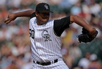 DENVER - MAY 18:  Pitcher Manny Corpas #60 of the Colorado Rockies delivers against the Minnesota Twins during Interleague MLB action at Coors Field on May 18, 2008 in Denver, Colorado. The Rockies defeated the Twins 6-2.  (Photo by Doug Pensinger/Getty Images)