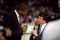 17 May 1992: NBC sportscaster Marv Albert and Earvin Magic Johnson talk during a game between the Chicago Bulls and the New York Knicks at the United Center in Chicago, Illinois.