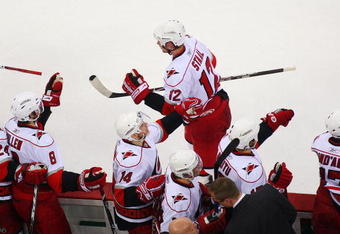 NEWARK, NJ - APRIL 28:  Eric Staal #12 of the Carolina Hurricanes celebrates his game-winning goal at 19:28 in the third period against the New Jersey Devils during Game Seven of the Eastern Conference Quarterfinal Round of the 2009 Stanley Cup Playoffs at the Prudential Center on April 28, 2009 in Newark, New Jersey. Hurricanes defeat the Devils 4-3  (Photo by Mike Stobe/Getty Images)
