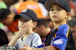 NEW YORK - JUNE 27: Young fans of the New York Yankees and the New York Mets watch at Shea Stadium on June 27, 2008 in the Flushing neighborhood of the Queens borough of New York City.  (Photo by Michael Heiman/Getty Images)