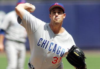 FLUSHING, NY - AUGUST 6:  Pitcher Greg Maddux #31 of the Chicago Cubs delivers a pitch against the New York Mets during the game at Shea Stadium on August 6, 2005 in Flushing, New York. The Mets defeated the Cubs 2-0.(Photo by Jim McIsaac /Getty Images)     