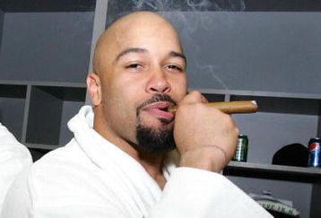 TAMPA, FL - FEBRUARY 01:  Larry Foote #50 of the Pittsburgh Steelers smokes a cigar in the locker room in celebration of their 27-23 win against the Arizona Cardinals during Super Bowl XLIII on February 1, 2009 at Raymond James Stadium in Tampa, Florida.  (Photo by Al Bello/Getty Images)