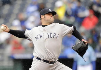 KANSAS CITY, MO - APRIL 12:  Joba Chamberlain #62 of the New York Yankees delivers the pitch against the Kansas City Royals on April 12, 2009 at Kauffman Stadium in Kansas City, Missouri. (Photo by G. Newman Lowrance/Getty Images)