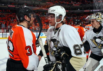 PHILADELPHIA - APRIL 25:  Darroll Powe #36 of the Philadelphia Flyers congratulates Sidney Crosby #87 of the Pittsburgh Penguins after Game Six of the Eastern Conference Quarterfinal Round of the 2009 NHL Stanley Cup Playoffs  at the Wachovia Center on April 25, 2009 in Philadelphia, Pennsylvania. The Penguins defeated the Flyers 5-3 to win the series 4 games to 2.  (Photo by Jim McIsaac/Getty Images)