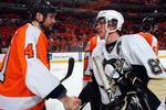 PHILADELPHIA - APRIL 25:  Andrew Alberts #41 of the Philadelphia Flyers congratulates Sidney Crosby #87 of the Pittsburgh Penguins after Game Six of the Eastern Conference Quarterfinal Round of the 2009 NHL Stanley Cup Playoffs  at the Wachovia Center on April 25, 2009 in Philadelphia, Pennsylvania. The Penguins defeated the Flyers 5-3 and won the series 4 games to 2.  (Photo by Jim McIsaac/Getty Images)
