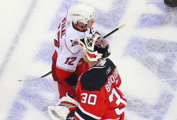 NEWARK, NJ - APRIL 28:  Eric Staal #12 of the Carolina Hurricanes is congratulated by Martin Brodeur #30 of the New Jersey Devils in Game Seven of the Eastern Conference Quarterfinal Round of the 2009 Stanley Cup Playoffs at the Prudential Center on April 28, 2009 in Newark, New Jersey. Hurricanes defeat the Devils 4-3  (Photo by Mike Stobe/Getty Images)