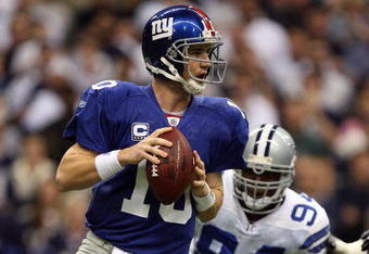IRVING, TX - DECEMBER 14:  Quarterback Eli Manning #10 of the New York Giants drops back to pass against the Dallas Cowboys in the first quarter at Texas Stadium on December 14, 2008 in Irving, Texas.  (Photo by Ronald Martinez/Getty Images)