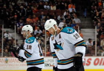 ANAHEIM, CA - APRIL 23:   Patrick Marleau #12, Joe Thornton #19 and Rob Blake #4 of the San Jose Sharks hang their heads as they skate into position for the faceoff during a break in late third period game action en route to a 4-0 loss the Anaheim Ducks during Game Four of the Western Conference Quarterfinal Round of the 2009 Stanley Cup Playoffs at Honda Center on April 23, 2009 in Anaheim, California.  (Photo by Kevork Djansezian/Getty Images)