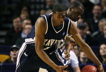 BOSTON - MARCH 26:  Sam Young #23 of the Pittsburgh Panthers and Derrick Brown #5 of the Xavier Musketeers fight to keep the ball in bounds during the NCAA Men's Basketball Tournament East Regionals at TD Banknorth Garden on March 26, 2009 in Boston, Massachusetts.  (Photo by Elsa/Getty Images)