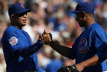 CHICAGO - APRIL 17: Aramis Ramirez #16 of the Chicago Cubs (L) congratulates teammate Carlos Marmol #49 after a win over the St. Louis Cardinals on April 17, 2009 at Wrigley Field in Chicago, Illinois. The Cubs defeated the Cardinals 8-7. (Photo by Jonathan Daniel/Getty Images)