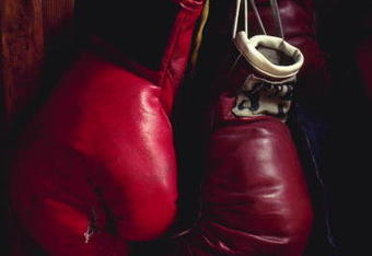 UNDATED:  BOXING GLOVES HANGING ON A NAIL