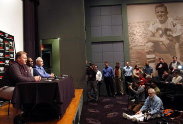 PHILADELPHIA - MARCH 16: (L-R)  Philadelphia Eagles head coach Andy Reid, newly acquired Philadelphia Eagles wide receiver Terrell Owens and Philadelphia Eagles owner Jeffrey Lurie speak with the media during a news conference March 16, 2004 in Philadelphia, Pennsylvania. Terrell Owens signed a $42 million dollar deal with the Philadelphia Eagles after he was acquired in a three way trade with the San Francisco 49ers and the Baltimore Ravens. (Photo by William Thomas Cain/Getty Images)