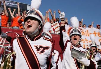JACKSONVILLE, FL - DECEMBER 1:  The Virginia Tech band cheers on the field as the Virginia Tech Hokies tie the game just before half-time while taking on the Boston College Eagles in the ACC Championship Game at Jacksonville Municipal Stadium December 1, 2007 in Jacksonville, Florida. Virginia Tech defeated Boston College 30-16.  (Photo by Doug Benc/Getty Images)