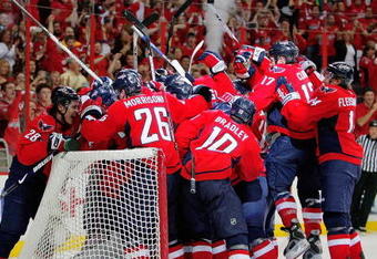WASHINGTON - APRIL 28:  Simeon Varlamov #40 of the Washington Capitals is mobbed by his teammates after they defeated the New York Rangers during Game Seven of the Eastern Conference Quarterfinal Round of the 2009 Stanley Cup Playoffs on April 28, 2009 at the Verizon Center in Washington,  DC.  (Photo by Len Redkoles/Getty Images)