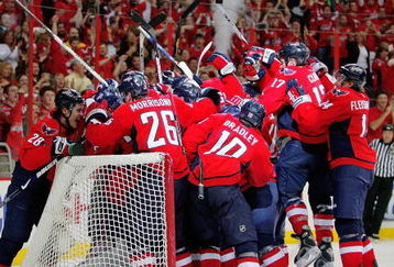WASHINGTON - APRIL 28:  Simeon Varlamov #40 of the Washington Capitals is mobbed by his teammates after they defeated the New York Rangers during Game Seven of the Eastern Conference Quarterfinal Round of the 2009 Stanley Cup Playoffs on April 28, 2009 at the Verizon Center in Washington,  DC.  (Photo by Len Redkoles/Getty Images)