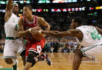 BOSTON - APRIL 28:  Derrick Rose #1 of the Chicago Bulls weaves through Rajon Rondo #9 and Tony Allen#42 of the Boston Celtics in Game Five of the Eastern Conference Quarterfinals during the 2009 NBA Playoffs at TD Banknorth Garden on April 28, 2009 in Boston, Massachusetts. The Celtics defeated the Bulls 106-104 in overtime. NOTE TO USER: User expressly acknowledges and agrees that, by downloading and or using this photograph, User is consenting to the terms and conditions of the Getty Images License Agreement.  (Photo by Elsa/Getty Images)