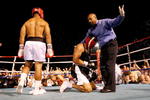 ATLANTIC CITY, NJ - JULY 12:  Referee Allan Huggins is hit with a can of beer as he stops the fight after former NFL player Via Sikahema knocked down former Major League Baseball player Jose Canseco in the first round during their celebrity boxing match on July 12, 2008 at Bernie Robbins Stadium in Atlantic City, New Jersey.  (Photo by Nick Laham/Getty Images)