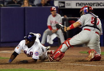 NEW YORK - APRIL 10:  Jose Reyes #7 of the New York Mets is safe at home in the twelth inning ahead of the tag from Chris Coste #27 of the Philadelphia Phillies on April 10, 2008 at Shea Stadium in the Flushing neighborhood of the Queens borough of New York City.  (Photo by Jim McIsaac/Getty Images)