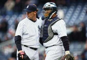 NEW YORK - APRIL 04: Pitcher Phil Coke #48 of the New York Yankees stands with catcher Jose Molina #26 against the Chicago Cubs during their game on April 4, 2009 at Yankee Stadium in the Bronx borough of New York City.  (Photo by Chris McGrath/Getty Images)