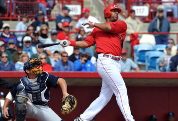 SARASOTA, FL - MARCH 1:  Outfielder Chris Dickerson #21 of the Cincinnati Reds follows through on a home run against the New York Yankees March 1, 2009 at Ed Smith Stadium in Sarasota, Florida.  (Photo by Al Messerschmidt/Getty Images)