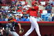 SARASOTA, FL - MARCH 1:  Outfielder Chris Dickerson #21 of the Cincinnati Reds follows through on a home run against the New York Yankees March 1, 2009 at Ed Smith Stadium in Sarasota, Florida.  (Photo by Al Messerschmidt/Getty Images)