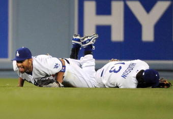 LOS ANGELES, CA - APRIL 30:  Matt Kemp #27 of the Los Angeles Dodgers reacts to his catch after diving over Orlando Hudson #13 for the third out against the San Diego Padres during the seventh inning at Dodger Stadium on April 30, 2009 in Los Angeles, California.  The Dodgers would win 8-5.  (Photo by Harry How/Getty Images)