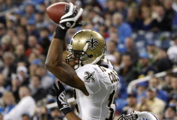 DETROIT - DECEMBER 21:  Wide receiver Marques Colston #12 of the New Orleans Saints scores on a six yard pass in the third quarter as Detroit Lions cornerback Ramzee Robinson #38 attempts to defend on December 21, 2008 at Ford Field in Detroit, Michigan. The New Orleans Saints defeated the Detroit Lions 42-7.  (Photo by Leon Halip/Getty Images)