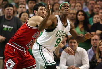 BOSTON - APRIL 28:  Rajon Rondo #9 of the Boston Celtics nabs the ball as Kirk Hinrich #12 of the Chicago Bulls defends in Game Five of the Eastern Conference Quarterfinals during the 2009 NBA Playoffs at TD Banknorth Garden on April 28, 2009 in Boston, Massachusetts. The Celtics defeated the Bulls 106-104 in overtime. NOTE TO USER: User expressly acknowledges and agrees that, by downloading and or using this photograph, User is consenting to the terms and conditions of the Getty Images License Agreement.  (Photo by Elsa/Getty Images)