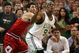BOSTON - APRIL 28:  Rajon Rondo #9 of the Boston Celtics nabs the ball as Kirk Hinrich #12 of the Chicago Bulls defends in Game Five of the Eastern Conference Quarterfinals during the 2009 NBA Playoffs at TD Banknorth Garden on April 28, 2009 in Boston, Massachusetts. The Celtics defeated the Bulls 106-104 in overtime. NOTE TO USER: User expressly acknowledges and agrees that, by downloading and or using this photograph, User is consenting to the terms and conditions of the Getty Images License Agreement.  (Photo by Elsa/Getty Images)