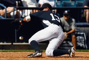 TAMPA, FL - FEBRUARY 28:  Third baseman Alex Rodriguez #13 of the New York Yankees is late on this line drive against the Minnesota Twins during a Grapefruit League Spring Training game at George M. Steinbrenner Field on February 28, 2009 in Tampa, Florida.  (Photo by J. Meric/Getty Images)