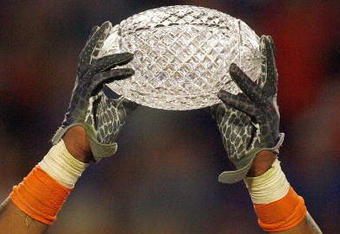 MIAMI - JANUARY 08:  Brandon Spikes #51 of the Florida Gators holds up the winning trophy after the FedEx BCS National Championship Game against the Oklahoma Sooners at Dolphin Stadium on January 8, 2009 in Miami, Florida.  (Photo by Eliot J. Schechter/Getty Images)