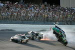 TALLADEGA, AL - APRIL 26:  Carl Edwards, driver of the #99 Claritin Ford, goes airborne as Ryan Newman, driver of the #39 Steweart-Haas Racing Chevrolet suffers damage and Brad Keselowski, driver of the #09 Miccosukee Indian Gaming Chevrolet drives at the conclusion of the NASCAR Sprint Cup Series Aaron's 499 at Talladega Superspeedway on April 26, 2009 in Talladega, Alabama.  (Photo by Jerry Markland/Getty Images for NASCAR)