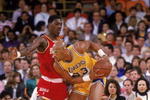 LOS ANGELES - 1987:  Kareem Abdul-Jabbar #33 of the Los Angeles Lakers posts up Hakeem Olajuwon #34 of the Houston Rockets during an NBA game at the Great Western Forum in Los Angeles, California in 1987. (Photo by: Rick Stewart/Getty Images)