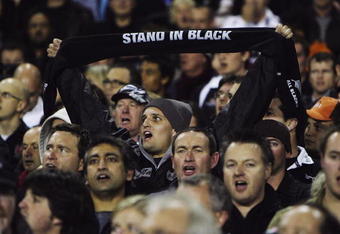 AUCKLAND, NEW ZEALAND - JUNE 14: An All Black fan sings in the crowd during the First Iveco Series Test match between New Zealand All Blacks and England at Eden Park on June 14, 2008 in Auckland, New Zealand.  (Photo by Phil Walter/Getty Images)