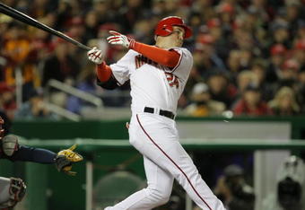 WASHINGTON, DC - MARCH 30: Nick Johnson #24  of the Washington Nationals hits a RBI double in the first inning during the game against the Atlanta Braves on opening day March 30, 2008 at Nationals Park in Washington, D.C. (Photo by Drew Hallowell/Getty Images) 