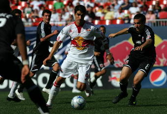 EAST RUTHERFORD, NJ - APRIL 26: Juan Pablo Angel #9 of the New York Red Bulls battles with Andrew Jacobson #9  of the D.C United  at Giants Stadium in the Meadowlands on April 26, 2009 in East Rutherford, New Jersey. D.C. United defeated the Red Bulls 3-2. (Photo by Chris Trotman/Getty Images for New York Red Bull)