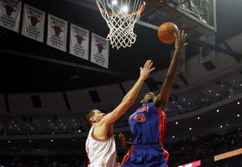 CHICAGO - MARCH 24: Amir Johnson #25 of the Detroit Pistons puts up a shot against Brad Miller #52 of the Chicago Bulls at the United Center March 24, 2009 in Chicago, Illinois. The Bulls defeated the Pistons 99-91. NOTE TO USER: User expressly acknowledges and agrees that, by downloading and/or using this Photograph, User is consenting to the terms and conditions of the Getty Images License Agreement. (Photo by Jonathan Daniel/Getty Images)