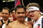 LAS VEGAS - NOVEMBER 18:  (L) Manny Pacquiao of the Philippines celebrates his knockout victory against Erik Morales with his trainer (R) Freddie Roach after their super featherweight bout at the Thomas & Mack Center on November 18, 2006 in Las Vegas, Nevada. Pacquiao knocked out Morales in the third round.  (Photo by Jed Jacobsohn/Getty Images)