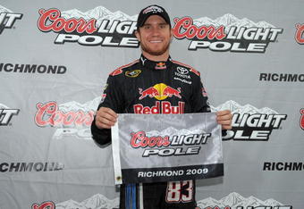 RICHMOND, VA - MAY 01:  Brian Vickers, driver of the #83 Red Bull Toyota, poses after winning the pole award during qualifying for the NASCAR Sprint Cup Series Crown Royal Presents the Russ Friedman 400 at Richmond International Raceway on May 1, 2009 in Richmond, Virginia.  (Photo by Drew Hallowell/Getty Images)