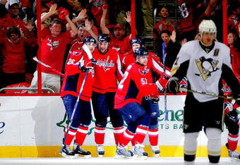 WASHINGTON - MAY 02:  David Steckel #39, Shaone Morrisonn #26 and Mike Green #52 of the Washington Capitals celebrates Steckel's goal against the Pittsburgh Penguins during Game One of the Eastern Conference Semifinal Round of the 2009 Stanley Cup Playoffs on May 2, 2009 at the Verizon Center in Washington,  DC.  (Photo by Len Redkoles/Getty Images)