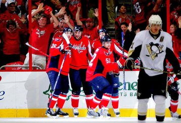 WASHINGTON - MAY 02:  David Steckel #39, Shaone Morrisonn #26 and Mike Green #52 of the Washington Capitals celebrates Steckel's goal against the Pittsburgh Penguins during Game One of the Eastern Conference Semifinal Round of the 2009 Stanley Cup Playoffs on May 2, 2009 at the Verizon Center in Washington,  DC.  (Photo by Len Redkoles/Getty Images)