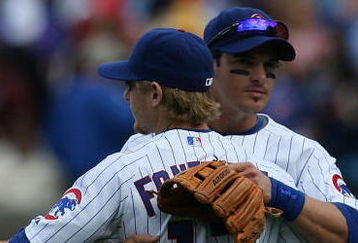 CHICAGO - MAY 02: Ryan Theriot #2 of the Chicago Cubs hugs teammate Mike Fontenot #17 after a win over the Florida Marlins on May 2, 2009 at Wrigley Field in Chicago, Illinois. The Cubs defeated the Marlins 6-1. (Photo by Jonathan Daniel/Getty Images)