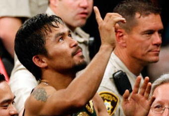 LAS VEGAS - MAY 02:  Manny Pacquiao of the Philippines celebrates after knocking out Ricky Hatton of England in the second round during their junior welterweight title fight at the MGM Grand Garden Arena May 2, 2009 in Las Vegas, Nevada.  (Photo by Ethan Miller/Getty Images)