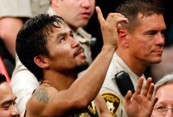 LAS VEGAS - MAY 02:  Manny Pacquiao of the Philippines celebrates after knocking out Ricky Hatton of England in the second round during their junior welterweight title fight at the MGM Grand Garden Arena May 2, 2009 in Las Vegas, Nevada.  (Photo by Ethan Miller/Getty Images)