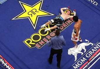LAS VEGAS - MAY 02:  Manny Pacquiao of the Philippines stands over Ricky Hatton of England after knocking him out in the second round during their junior welterweight title fight at the MGM Grand Garden Arena May 2, 2009 in Las Vegas, Nevada.  (Photo by Al Bello/Getty Images)