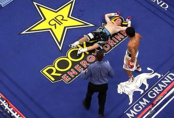 LAS VEGAS - MAY 02:  Manny Pacquiao of the Philippines stands over Ricky Hatton of England after knocking him out in the second round during their junior welterweight title fight at the MGM Grand Garden Arena May 2, 2009 in Las Vegas, Nevada.  (Photo by Al Bello/Getty Images)